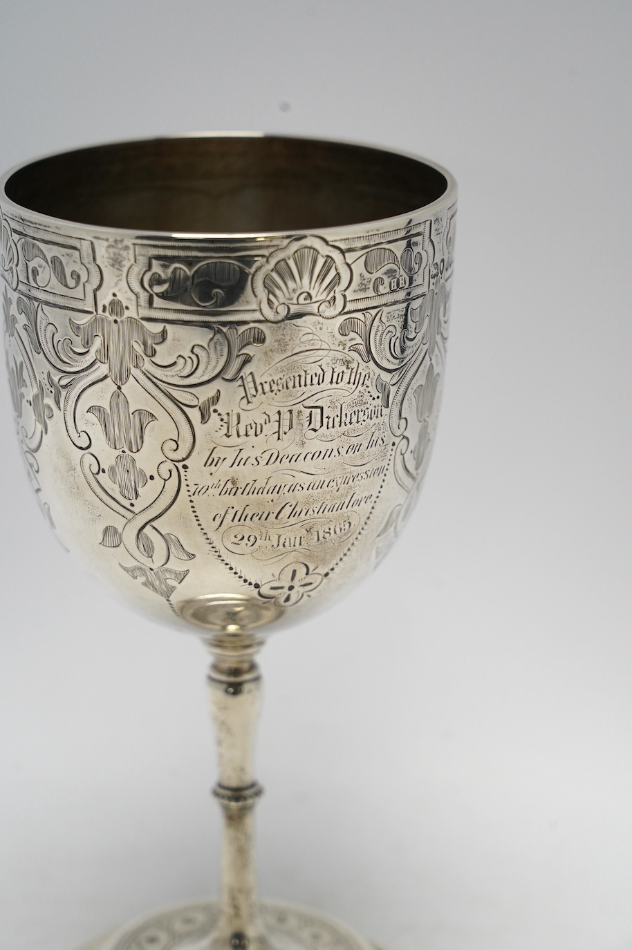 A Victorian engraved silver goblet, by Henry Holland, London, 1863, with engraved inscription, height 18.4cm, 7.9oz. Condition - fair